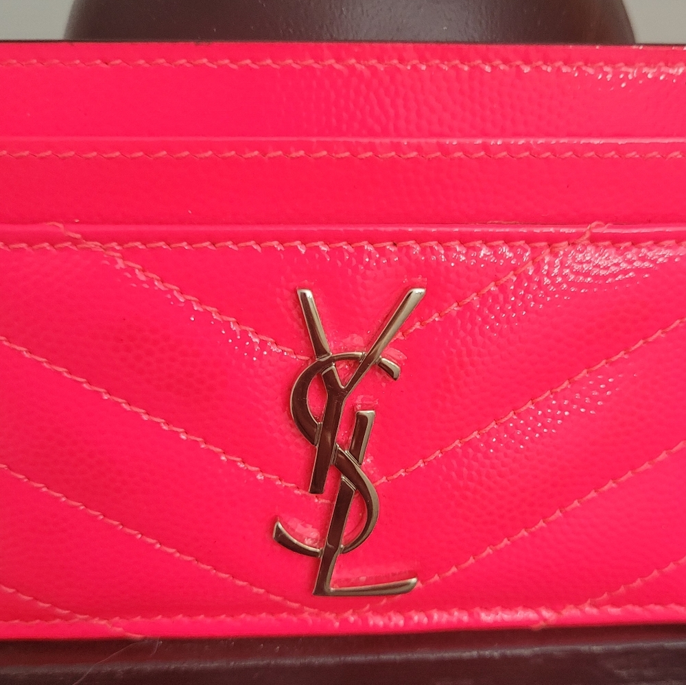 YSL, Saint Laurent card holder in neon pink shiny leather.